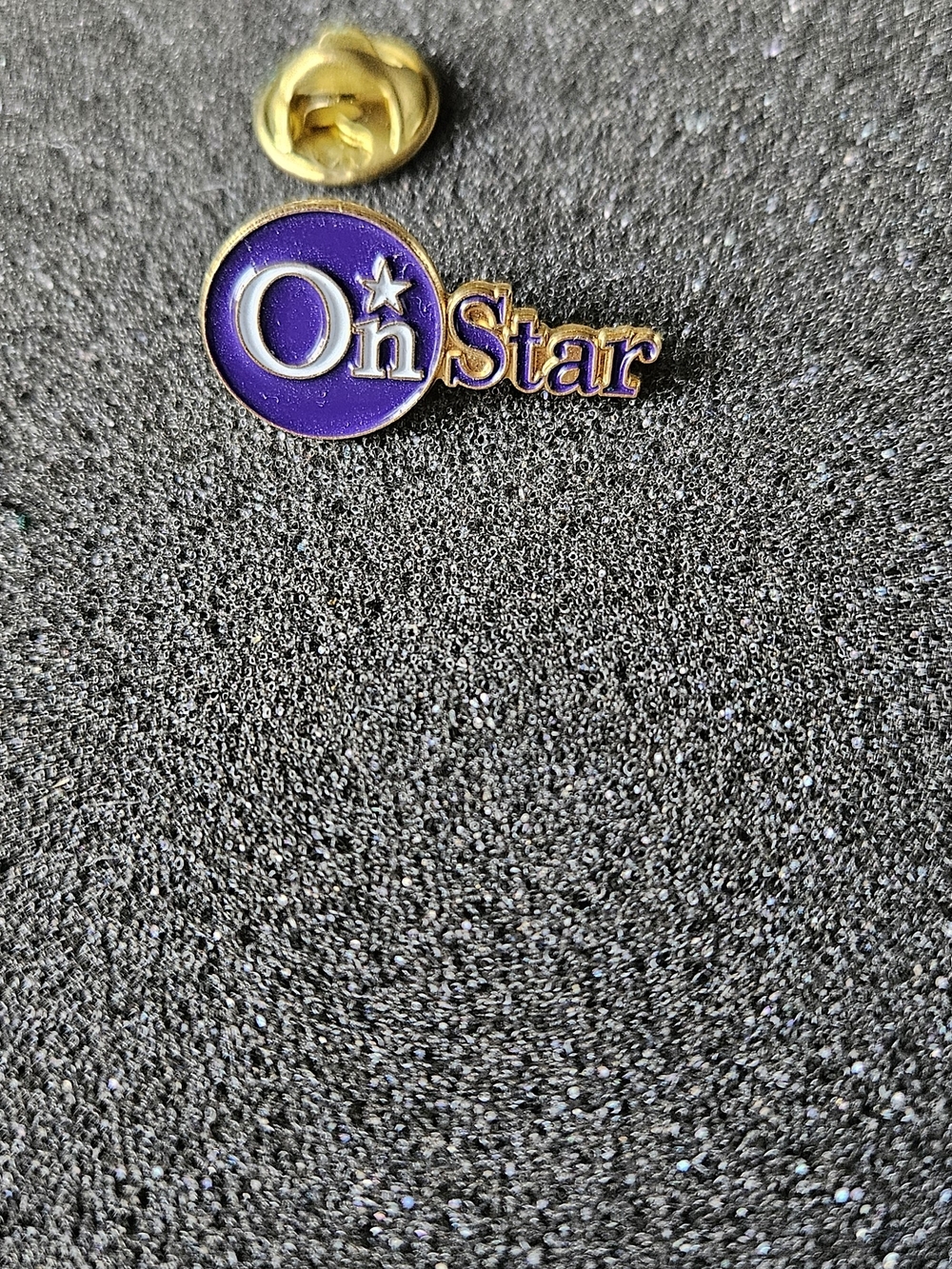 Onstar Purple and Gold Enamel Pin.
